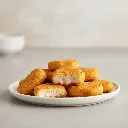 crispy-golden-chicken-nuggets-on-white-ceramic-plate_a4320cc7-8bfd-442d-b759-78ca26a983d0.webp
